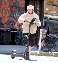 Deborra-Lee Furness Riding Her Scooter - NYC