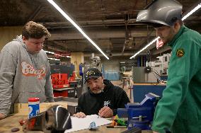 Disabled Army Veteran Working With Engineering Students At The University Of Cincinnati.