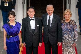President Joe Biden greets Prime Minister Kishida Fumio