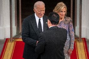 President Joe Biden greets Prime Minister Kishida Fumio