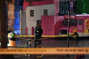 Two People Shot As They Stood On A Sidewalk; One In Critical Condition