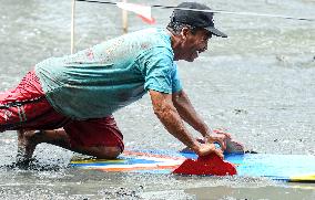 INDONESIA-PASURUAN-TRADITIONAL MUD SURFING-RACE