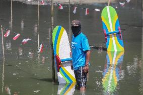 Traditional Mud Surfing Competition In Indonesia