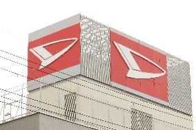 Exterior view, logo, and signage of Daihatsu Motor's head office