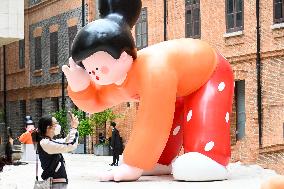 A Low-back Girl Art Installation in Shanghai