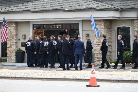 General Public And Law Enforcement Officers Enter Wake For Murdered Police Officer Luis Huesca
