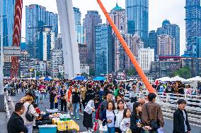 Tourists Gather at Qiansimen Bridge in Chongqing