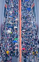 Tourists Gather at Qiansimen Bridge in Chongqing