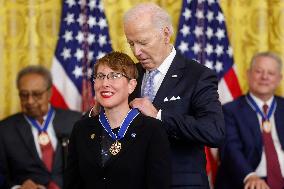 President Biden presents Rigby with the Presidential Medal of Freedom