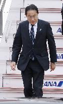 Japan PM Kishida returns home