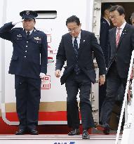 Japan PM Kishida returns home