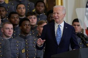 President Biden Hold A Black Knight Trophy Football Team Presentation