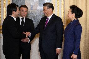 France's President Emmanuel Macron, Chinese President Xi Jinping during presentations ahead of an official state dinner