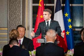 France's President Emmanuel Macron, Chinese President Xi Jinping during presentations ahead of an official state dinner