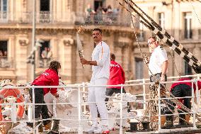 Florent Manaudou with the Olympic torch onboard the Belem - Marseille