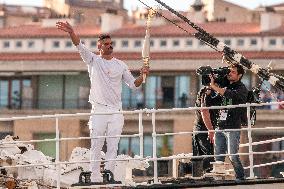 Florent Manaudou with the Olympic torch onboard the Belem - Marseille