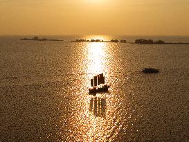 Sailboats in The Sunset Glow in Huai 'an