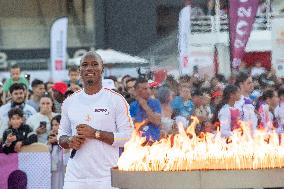 Olympic And Paralympic Torch Relays - Didier Drogba Holds The Olympic Torch