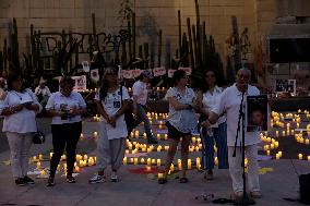 Searching Mothers At Vigil For Missing Persons