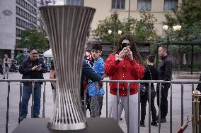 Olympiacos Fans Are Photographed With The Conference Cup Trophy