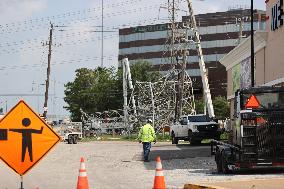 Electrical Crews Work To Restore Power To Houston Residents After Deadly Storm