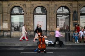 Cello Player In Streets Of Warsaw
