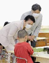 Japanese emperor, empress at kindergarten