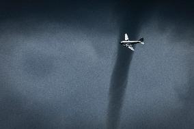A Mini-Tornado Forms Over Air Show - La Ferte-Alais