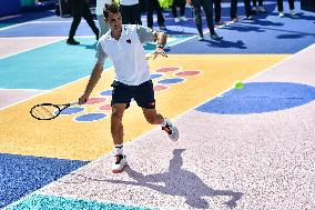 Roger Federer performs during the inauguration of a tennis court in Courneuve north Paris FA
