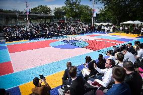 Roger Federer performs during the inauguration of a tennis court in Courneuve north Paris FA