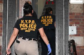 Crime Scene Investigators Search For Evidence Following Shooting Death Of 37-Year-Old Man In Bronx New York