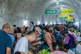 Vegetable Farmers Sell Vegetables at A Bomb Shelter in Chongqing