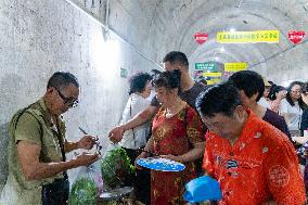 Vegetable Farmers Sell Vegetables at A Bomb Shelter in Chongqing