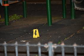 Crime Scene Investigators Mark Shell Casings And Other Evidence At A Fatal Shooting In Brooklyn New York