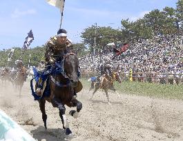 Armored warriors compete in horse race
