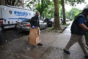 Crime Scene Investigators At Scene Of Two People Found Dead With Gunshot Wounds In Brooklyn New York