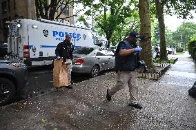Crime Scene Investigators At Scene Of Two People Found Dead With Gunshot Wounds In Brooklyn New York