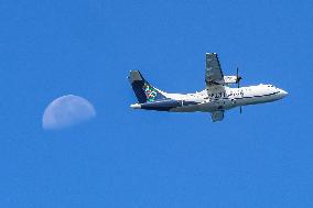Olympic Air ATR 42 Passing In Front Of The Moon