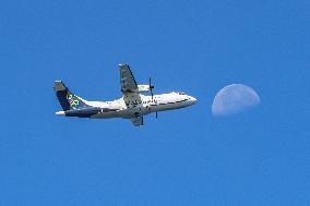 Olympic Air ATR 42 Passing In Front Of The Moon
