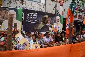 BJP Supporters Hold Modi Portrait Ahead of Kolkata Roadshow During Final Election Phase