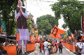 BJP Supporters Hold Modi Portrait Ahead of Kolkata Roadshow During Final Election Phase
