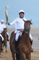 The Olympic Flame Makes A Stop On Omaha Beach - Normandy