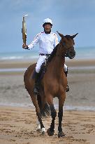 The Olympic Flame Makes A Stop On Omaha Beach - Normandy