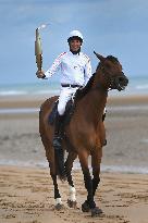 The Olympic Flame Makes A Stop On Omaha Beach - Normandy