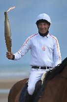 The Olympic Flame Makes A Stop On Omaha Beach - Normandy