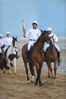 The Olympic Flame Makes A Stop On Omaha Beach - Normandy