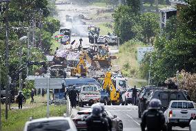 Police Forces Removing Blockage On Rue Iekawe In Noumea