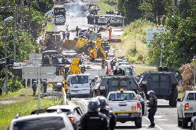 Police Forces Removing Blockage On Rue Iekawe In Noumea