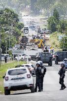 Police Forces Removing Blockage On Rue Iekawe In Noumea