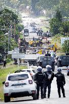 Police Forces Removing Blockage On Rue Iekawe In Noumea